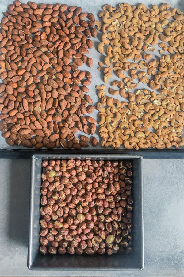 Roasted almonds, hazelnuts and cashews in trays