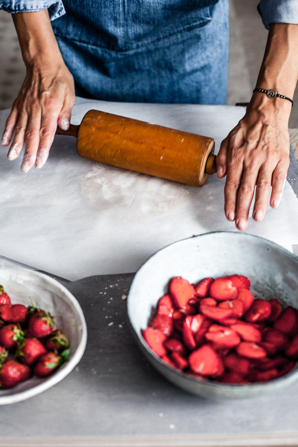 Making of strawberry galette, rolling the dough in between 2 sheets of parchment paper, Maja Brekalo