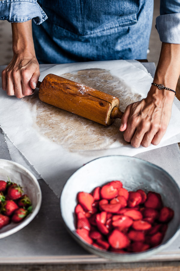 Making of strawberry galette, rolling the dough in between 2 sheets of parchment paper, Maja Brekalo