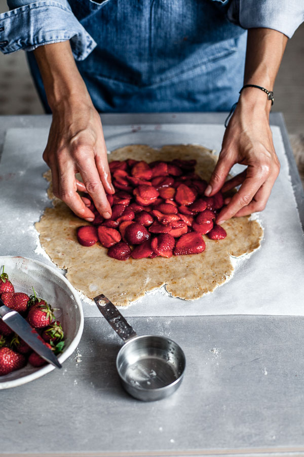 Making of strawberry galette, placing strawberries on rolled out pastry, Maja Brekalo