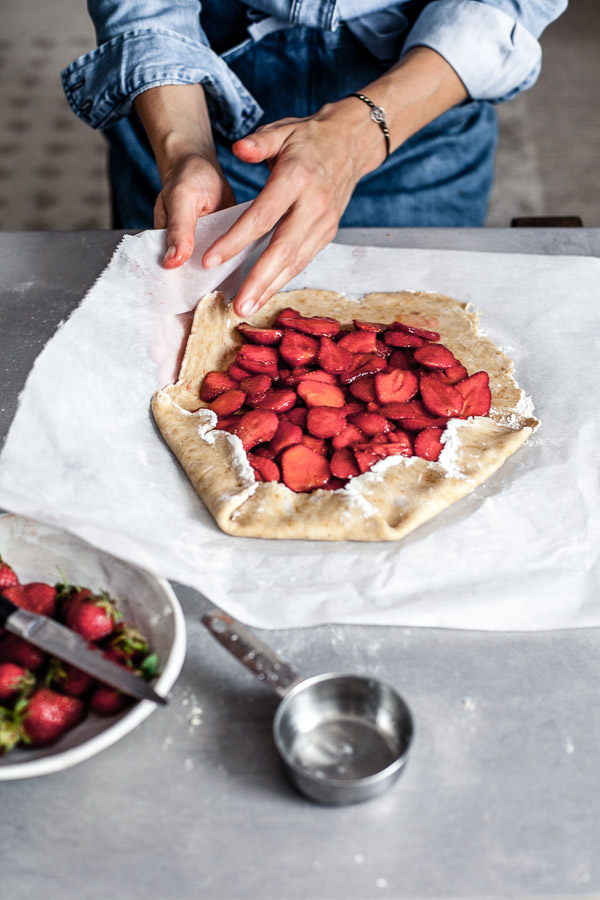 Making of strawberry galette, Puling up the edges of pastry over filling, Maja Brekalo