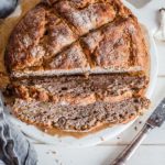 Buckwheat-soda-bread-sliced-on-white-wooden-board-maja-brekalo