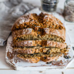 No-yeast-bread-sliced-on-a-wooden-white-board-maja-brekalo